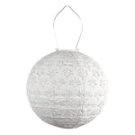 White spherical lantern with floral patterns on a white background