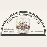 A product label graphic for Napa Wildflower Co. Premium Crimson Clover Wildflower Seed Blend, featuring a central floral illustration with a wine bottle and the brand name, set against a light cream background.
