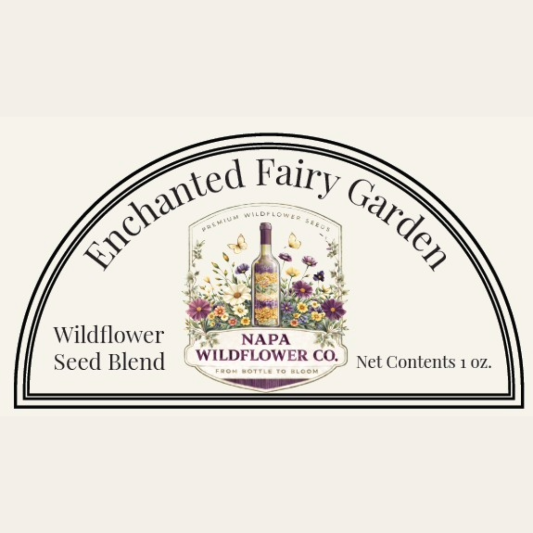 A product label graphic for Napa Wildflower Co. Enchanted Fairy Garden Wildflower Seed Blend, featuring a semi-circular border with floral and botanical illustrations in the center and text indicating the seed blend and 1 oz net contents.