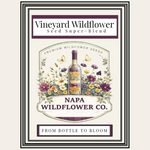 A vintage-style product label for Vineyard Wildflower Séed Super-Blend by Napa Wildflower Co., featuring a central bottle illustration surrounded by colorful wildflowers and butterflies on an off-white background.