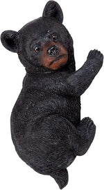 Black bear figurine on a white background