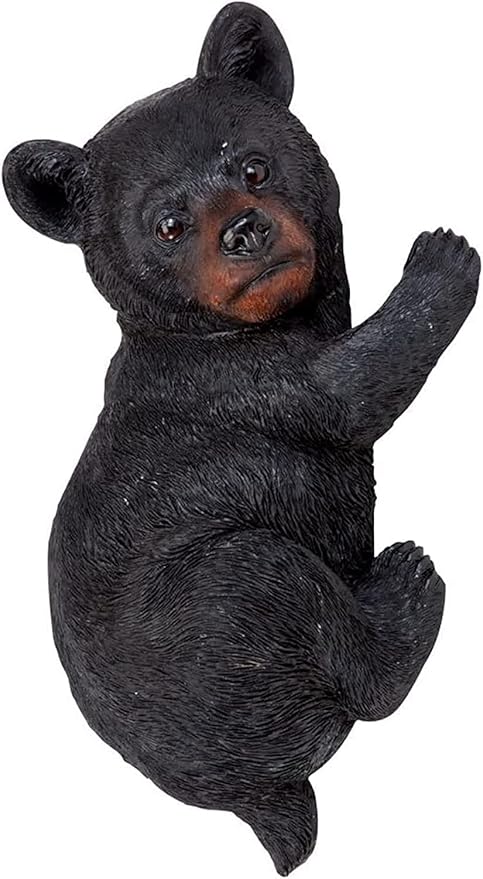 Black bear figurine on a white background