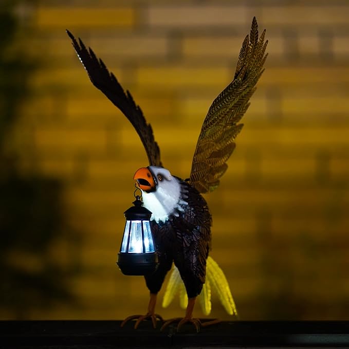 Decorative eagle with a lantern against a brick wall background