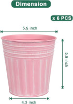 Pink metal planter with dimensions labeled on a white background