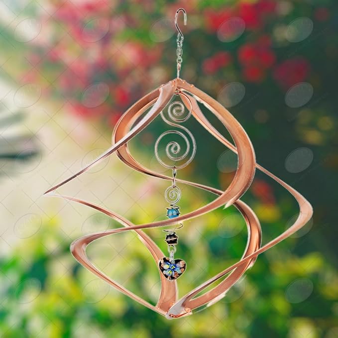 Decorative wind chime with spiral design and beads against a blurred natural background