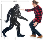 Person next to a large black silhouette of a creature, likely Bigfoot, with height measurements indicated.