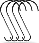 Set of black metal S-shaped hooks on a white background