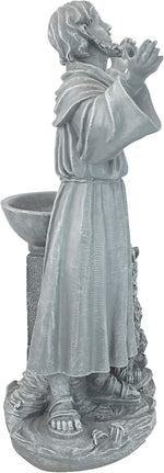 Statue of a monk with a bowl and candle, likely made of stone or concrete.