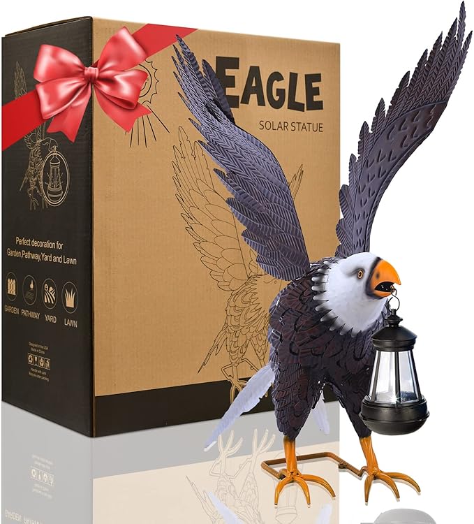 Solar eagle statue with open wings next to its packaging box.