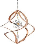 Decorative wind chime with copper spiral design and floral element on a white background