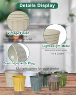 Metal pots with features highlighted on a wooden surface