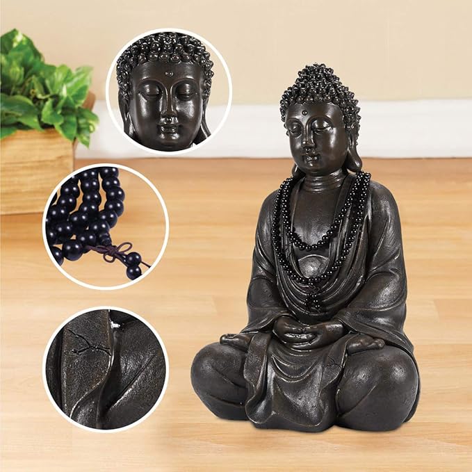 Black Buddha statue with close-up details on a wooden surface