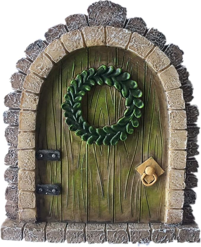 Decorative fairy door with a wreath on a white background