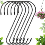 Set of black metal hooks with a plant in the background