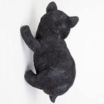 Black bear figurine on a white background
