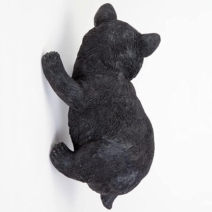Black bear figurine on a white background