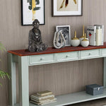 Console table with decorative items against a wall with framed art.