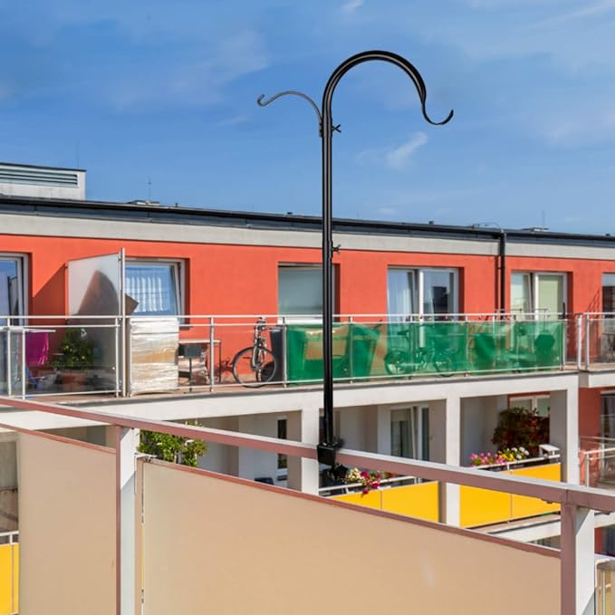 Multistory building with balconies and a clear blue sky