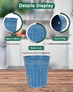 Blue metal plant pot with features highlighted on a wooden surface