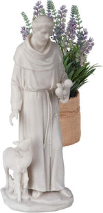 Statue of a religious figure holding a lamb and flowers, with a basket in the background.