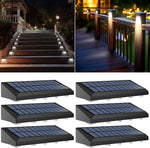 Solar-powered outdoor lights on a wooden deck and steps at night.