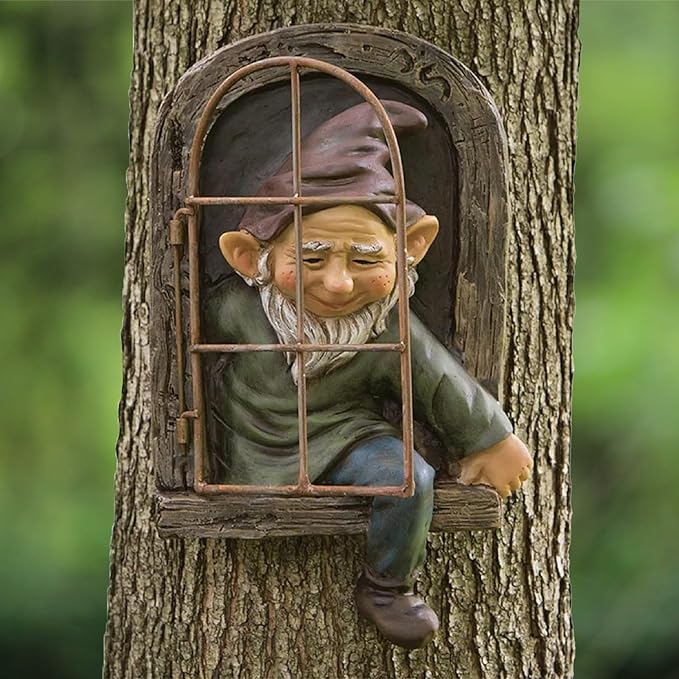 Gnome figurine sitting inside a window frame embedded in a tree trunk.