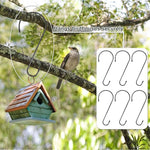 Birdhouse hanging from a S-hook on a tree branch with additional hooks displayed.