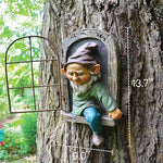 Gnome figurine sitting in a window cutout of a tree with measurements indicated.