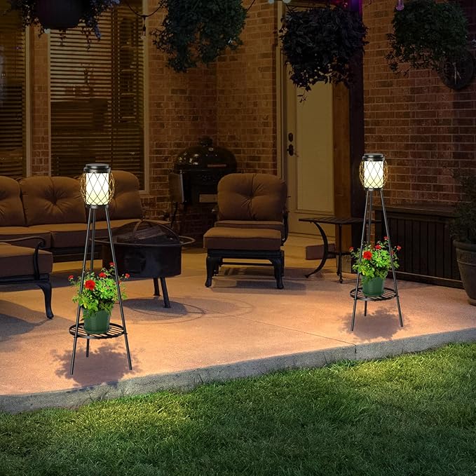 Outdoor patio area with chairs, a fire pit, and decorative lights.