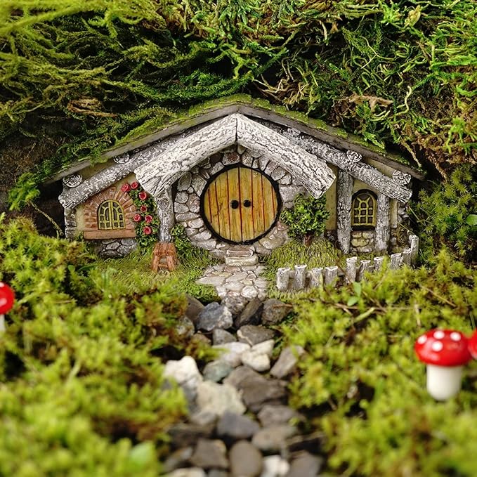 Miniature stone cottage with a round door in a forest setting