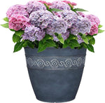 Decorative pot with pink and purple flowers on a white background