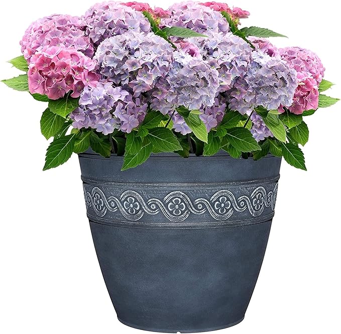 Decorative pot with pink and purple flowers on a white background