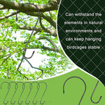 Metal birdcage hooks hanging from a tree branch with text about durability.