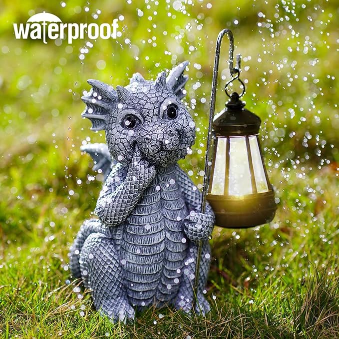 Dragon figurine holding a lantern in grass with 'waterproof' text above