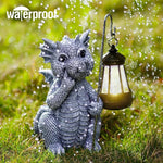 Dragon figurine holding a lantern in grass with 'waterproof' text above