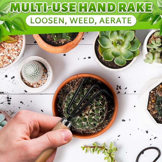 Hand holding a multi-use hand rake over potted plants on a white surface.