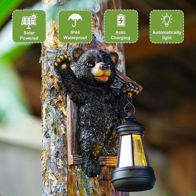 Solar-powered bear lamp with lantern on a tree trunk