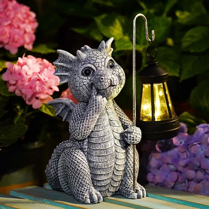 Dragon figurine holding a lantern with flowers in the background