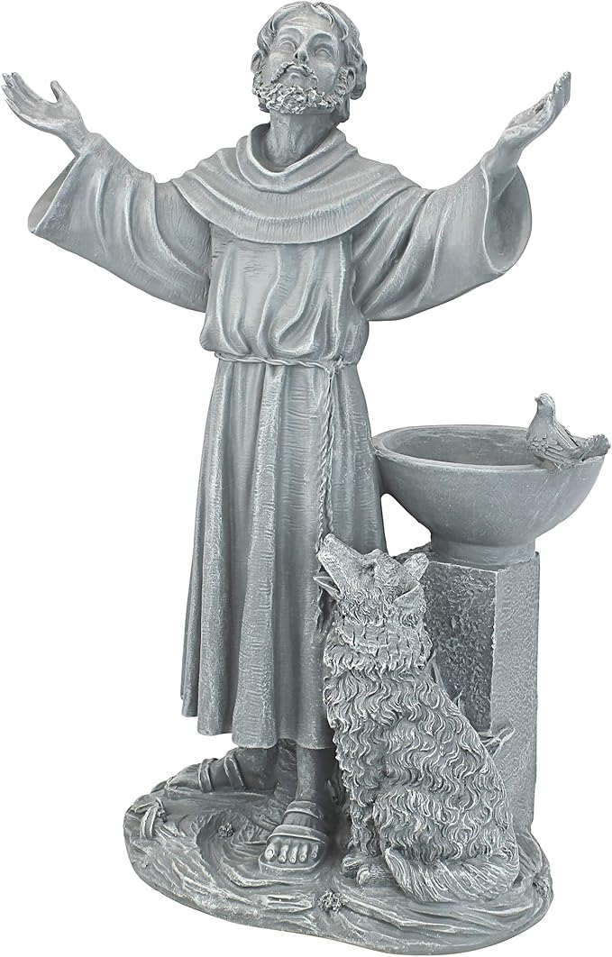 Statue of a religious figure with outstretched arms and a dog beside a bowl on a white background