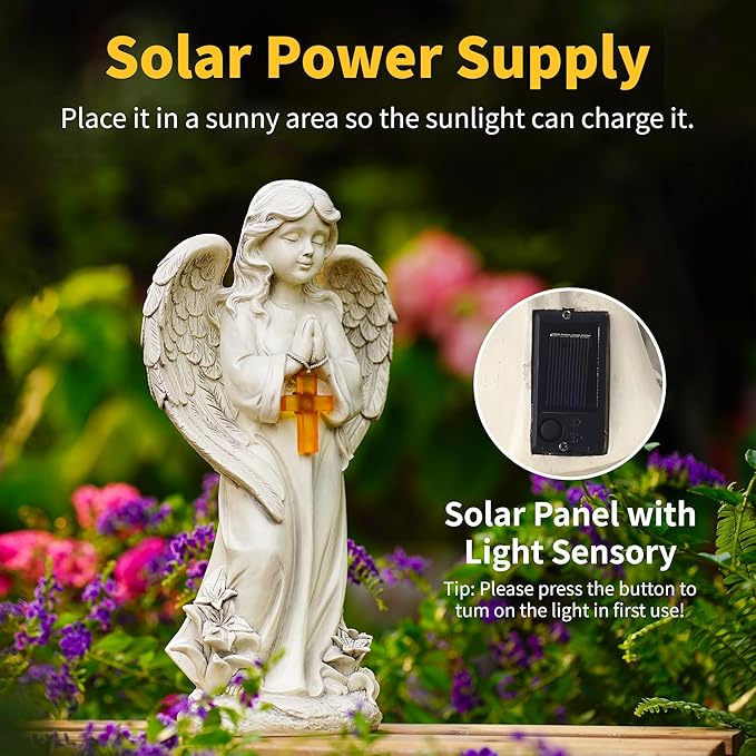 Solar-powered angel statue with solar panel and light sensory feature, placed in a garden setting.