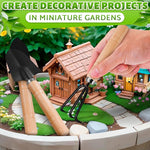 Miniature garden setup with a small wooden cabin, tools, and decorative elements.
