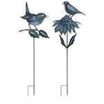Two decorative garden stakes with birds and flowers on a white background