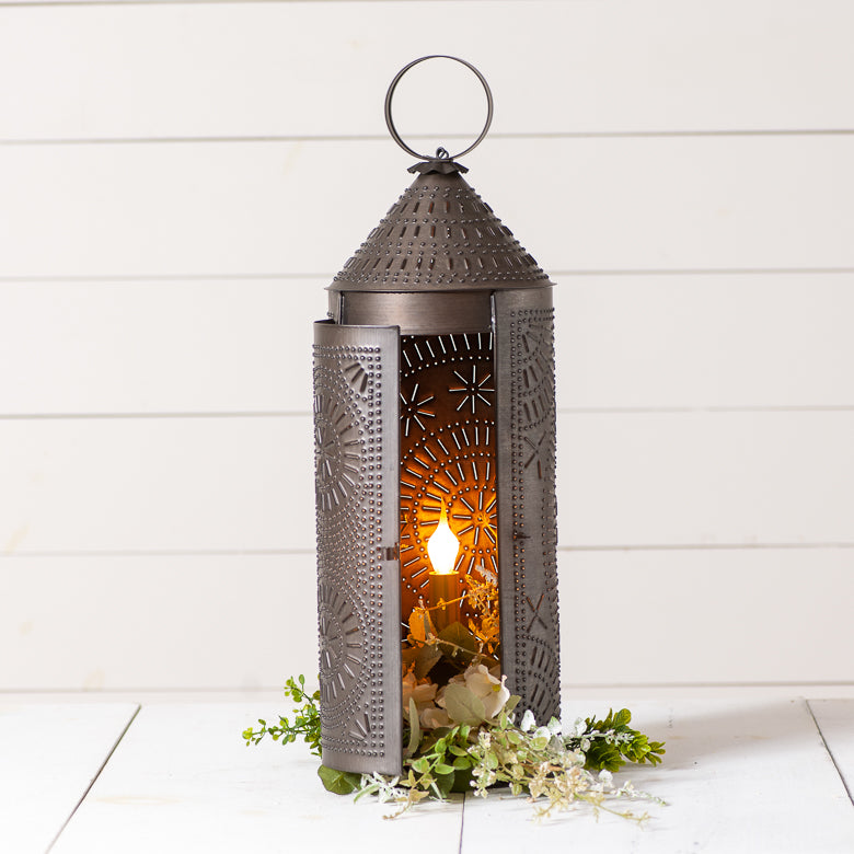 Decorative lantern with intricate patterns on a white wooden background