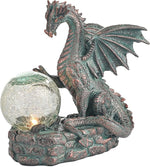 Dragon statue with a crystal ball on a white background