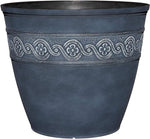 Decorative dark blue planter with floral patterns on a white background