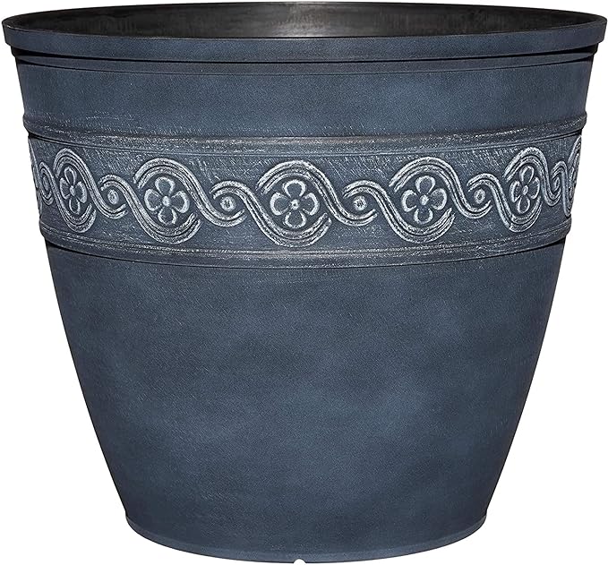 Decorative dark blue planter with floral patterns on a white background