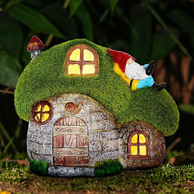 Fairy house with a gnome on a grassy background