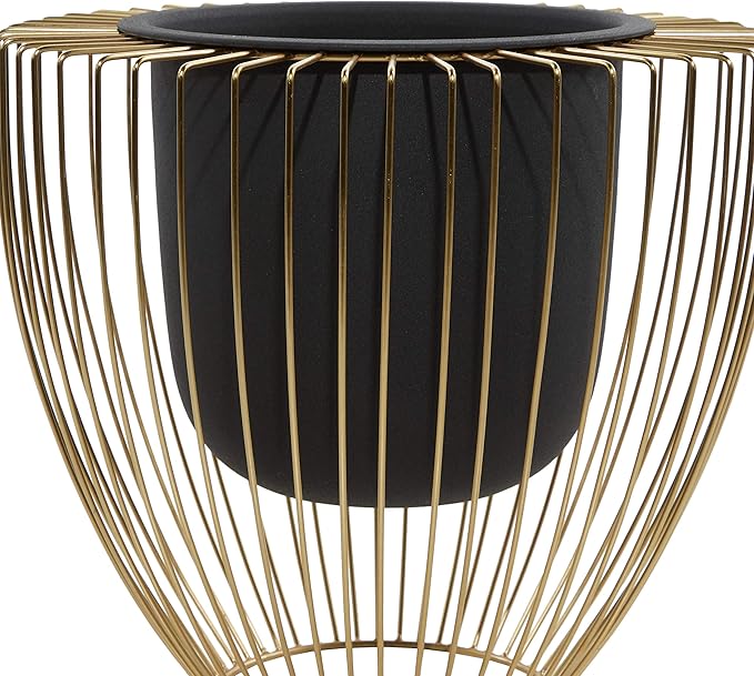 Black planter inside a gold wire basket on a white background