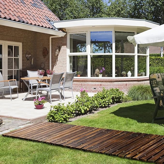 Outdoor patio area with furniture and garden decorations in a residential setting