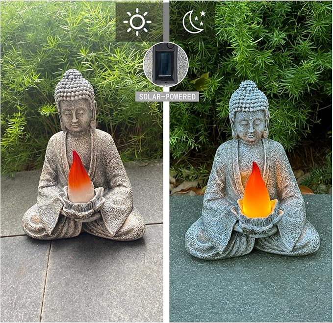 Solar-powered Buddha statue with flame-like light on a garden path.